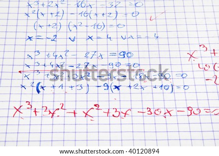 maths calculations with teacher\'s corrections in red