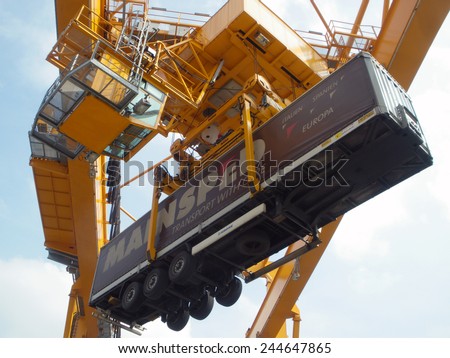 DUISBURG, GERMANY - 04 April 2013 Portal-crane with Semi-Trailer vehicle in Logistics Center - Logport Duisburg