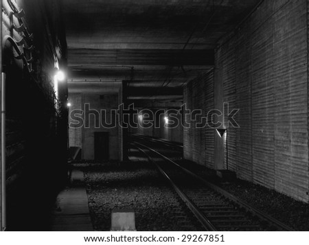 The dark tunnel deeply under the ground, an interval between stops