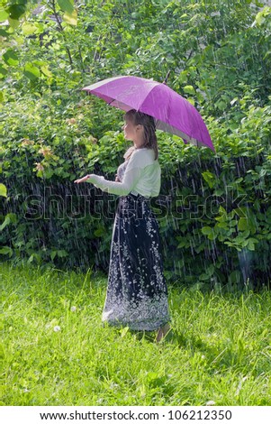 Woman walks in the rain