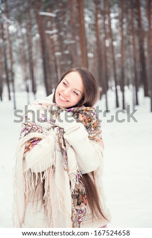 Young woman in winter forest