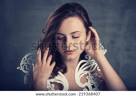 Portrait of a beautiful brunette girl  on grunge  background