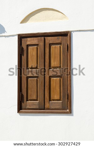 Brown shutters of greek house