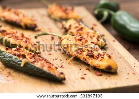 Homemade jalapeno baked with cheese, sauce and flakes of red pepper