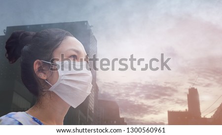 women wearing facial hygienic mask for Safety outdoor. People in masks because of fine dust in thailand. Problems found in major cities around the world. air pollution,Environmental awareness concept