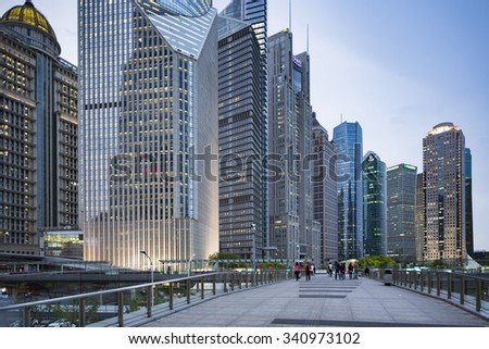SHANGHAI- APRIL 21, People walking on a elevated pedastridan bridge between Shanghai international financial center, Bank of China and others Skyscraper group at Pudong. .SHANGHAI, APRIL 21, 2015