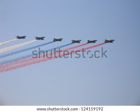 ZHUKOVSKY, RUSSIA - AUGUST 12: The Russian aerobatic team on military fighters Su-25 with smoke in sky at International Airshow 100 years the Russian Air Force on August 12, 2012 in Zhukovsky, Russia