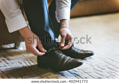 Men wearing work black boot. returning to the house.