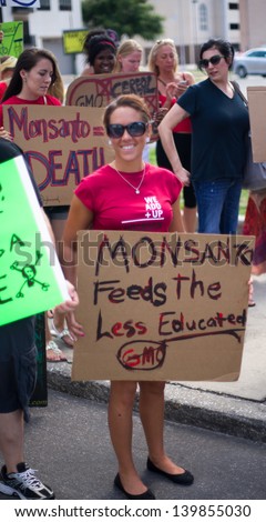 ORLANDO, FL-MAY 25:  Protesters rallied in the streets against the Monsanto corporation. The company is accused of genetically modifying foods unsafely. May 25, 2013 in Orlando, Florida.