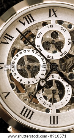 Gentleman’s watch, with exposed mechanism showing wheels and cogs