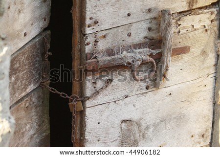 ruined door with padlock