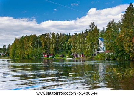 Summer cotages near lake in Finland. You can see pier that goes from sauna