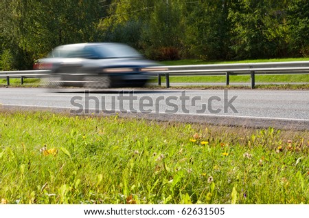 Fast moving car on highway