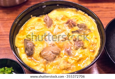 Bowl of rice topped with chicken and eggs at Tamahide,tokyo,japan