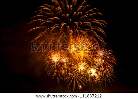 Set of red and yellow sparks of salute on a black background of the sky