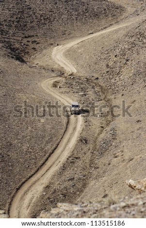 The car goes on the twisting road of Lake Baikal