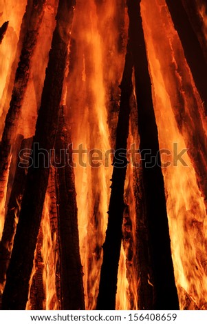 Beautiful and bright flame on fire. The wooden building burns.