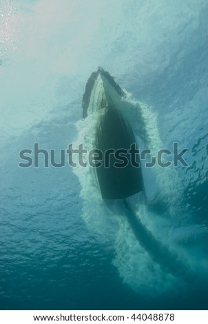 Underwater view of a speed boat moving fast over the surface. Red Sea, Egypt.