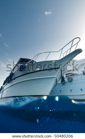 Low angle split view of the bow of a wooden dive boat.