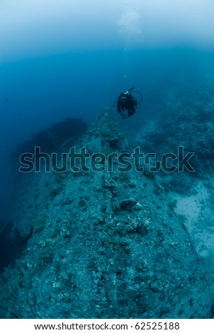 A female scuba diver exploring the bow of the SS Dunraven. Beacon rock, Ras Mohammed national Park, Red Sea, Egypt. SS Dunraven. Beacon rock, Ras Mohammed national Park, Red Sea, Egypt.