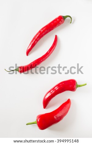 Four chili pepper on the white background