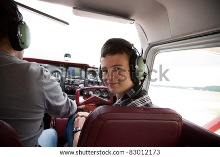 boy fliyng in the plane cabin