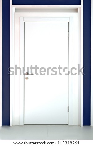 Modern white entrance door with silver knob