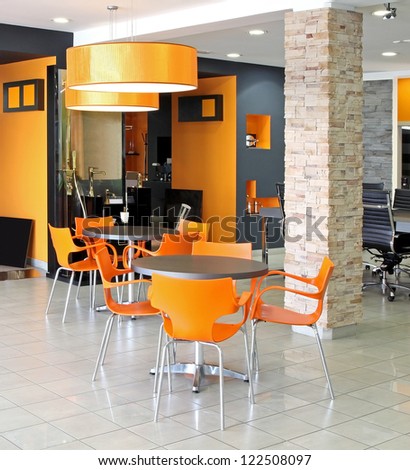 Small waiting area tables inside modern office space