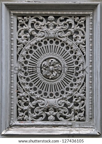 Detail of gray stone ornament on building facade