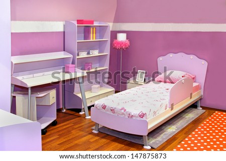 Modern child bedroom interior with pink furniture