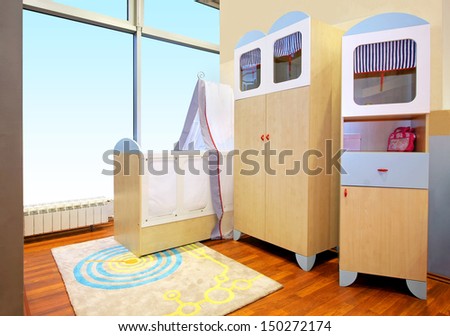 Modern nursery room interior with baby crib