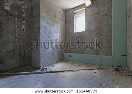 Empty old house interior with bare walls under renovation