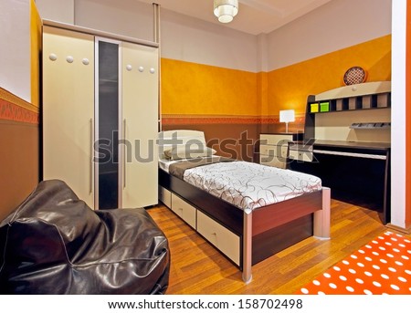 Modern orange child bedroom interior with beige furniture
