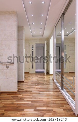 Entrance interior corridor inside large house and big mirror on the wall