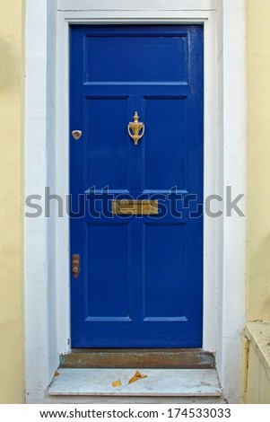 Residential house retro dark blue front door closed