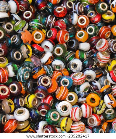Pile of colorful beads with holes in the middle for making jewelry