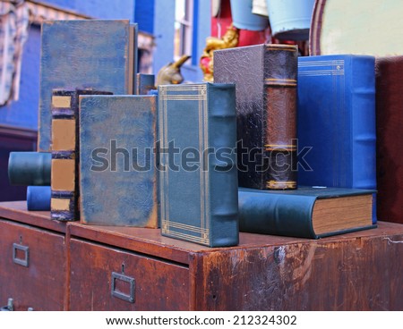 Old used books in hard cover sold on vintage market