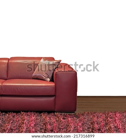 Dark leather sofa with silk pillow in corner