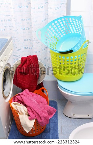 Wet towels washed in laundry machine and put into plastic basket