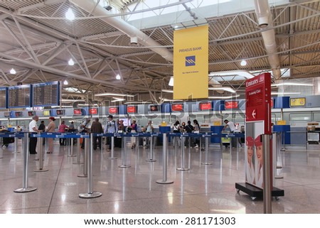 ATHENS, GREECE - May 05: Check in counters at Athens International airport with passengers waiting in line in Athens, Greece - May 05, 2015; Eleftherios Venizelos is Athens primary civilian airport