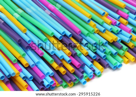 Large pile of colorful plastic drinking straws
