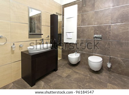 Modern bathroom interior with marble tiles and contemporary fixtures