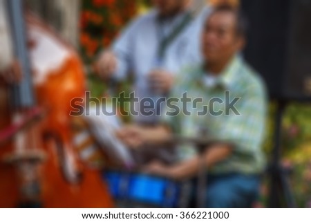 Blurred background : People in music garden at Chiangmai University