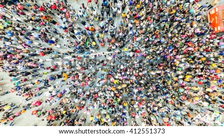 crowd of people in center of town, top view