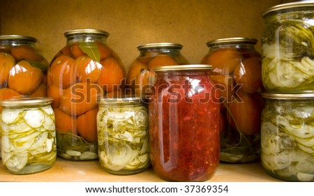 Jars with preserves homemade vegetables and jam.