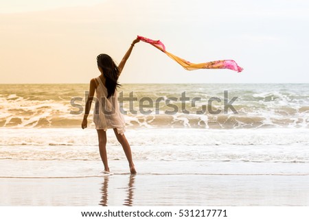 Beautiful asian Girl With Scarf on The Beach,woman freedom