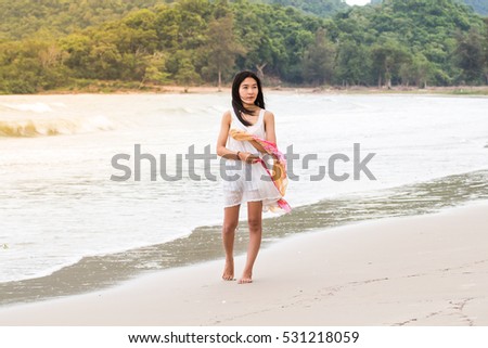 Beautiful asian Girl With Scarf on The Beach,woman freedom