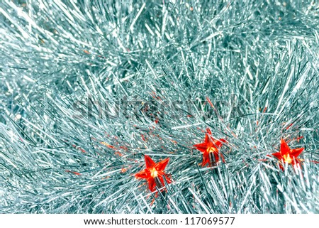 Three red star lights on silver background