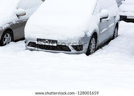 Snow covered cars after snowfall