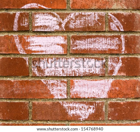 Chalk drawing on red brick wall